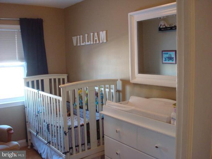 1009 Downton Road Halethorpe, MD 21227 - Photo 17 of 30 a bedroom with a bed and a window