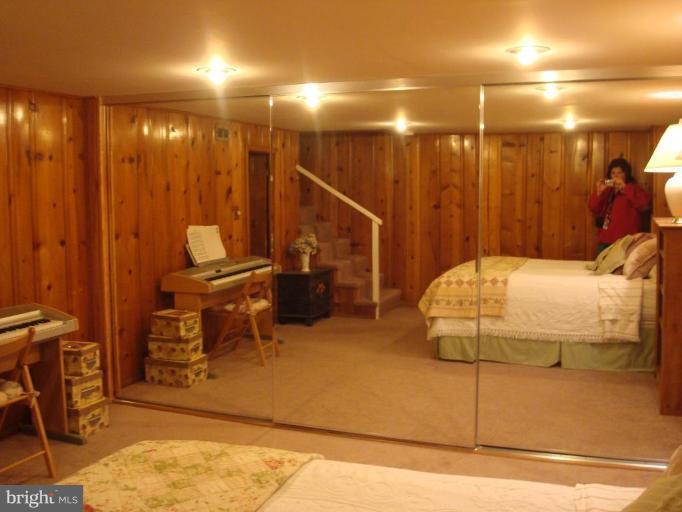 1009 Downton Road Halethorpe, MD 21227 - Photo 23 of 30 a bedroom with a bed and a view of bathroom