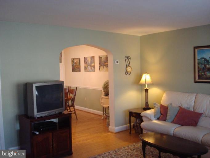 1009 Downton Road Halethorpe, MD 21227 - Photo 5 of 30 a living room with furniture and a flat screen tv