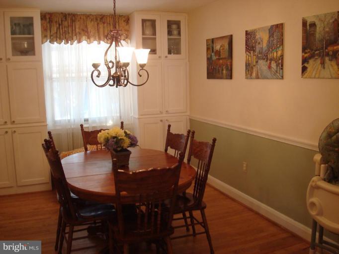 1009 Downton Road Halethorpe, MD 21227 - Photo 7 of 30 a view of a dining room with furniture and chandelier