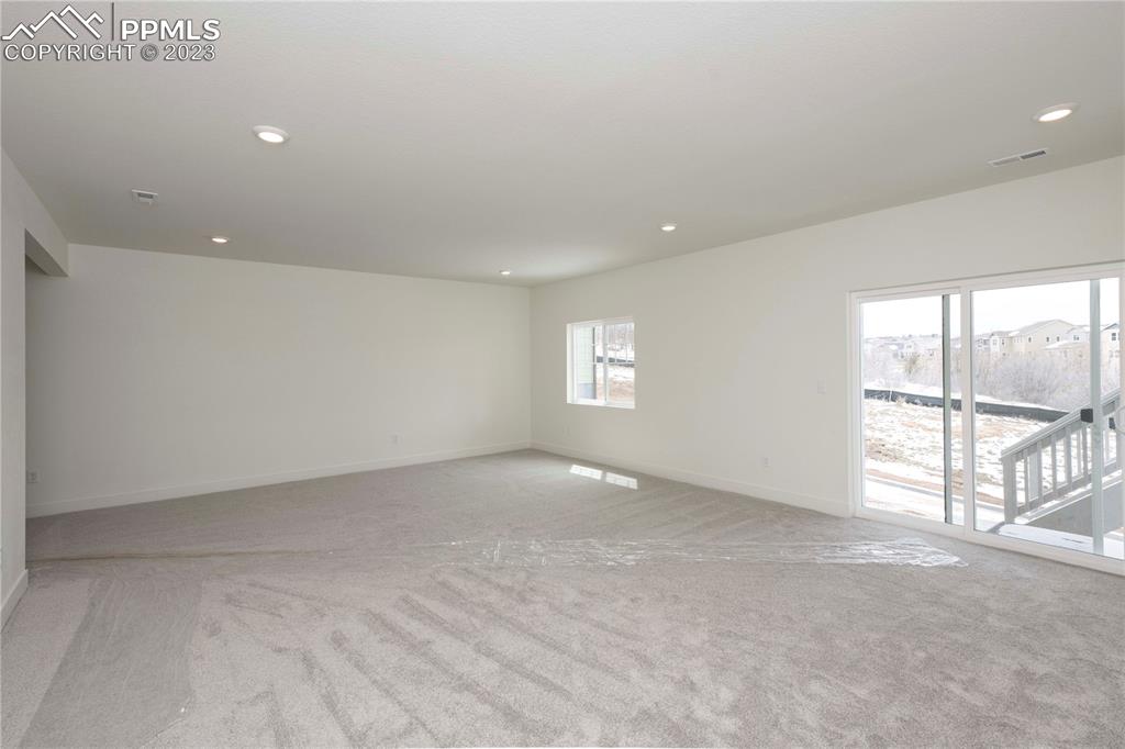 2042 Peachleaf Loop Castle Rock, CO 80108 - Photo 22 of 26 an empty room with windows