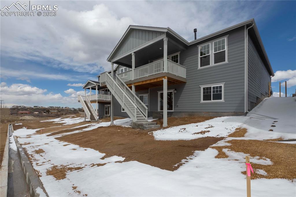 2042 Peachleaf Loop Castle Rock, CO 80108 - Photo 26 of 26 a front view of a house with a yard