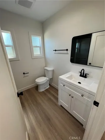 a large kitchen with stainless steel appliances a large counter top