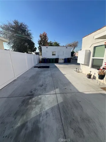 a kitchen with granite countertop a stove a sink and a microwave