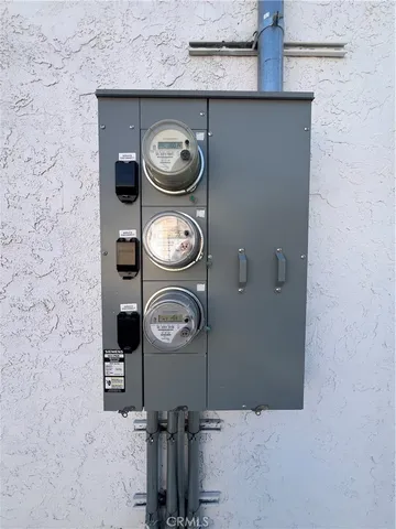 a kitchen with white cabinets and appliances