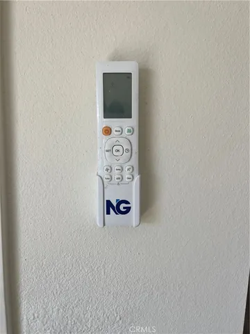 a large kitchen with stainless steel appliances a stove a refrigerator a sink a microwave and cabinets