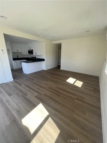 a view of a room with furniture and window