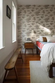 a bedroom with bed and a window