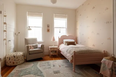 a bedroom with a bed and a couch