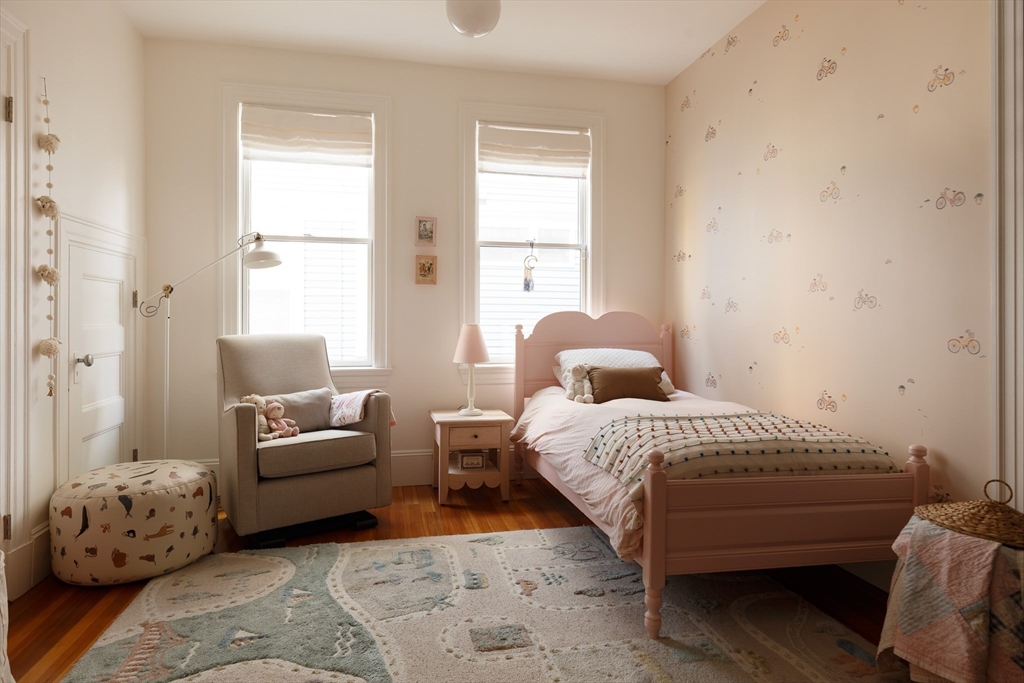 465 Huron Avenue, Unit 1 Cambridge, MA 02138 - Photo 16 of 23 a bedroom with a bed and a couch