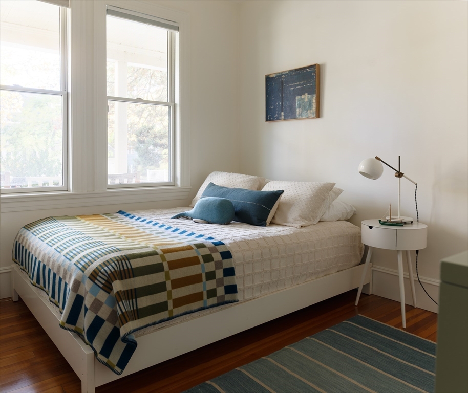 465 Huron Avenue, Unit 1 Cambridge, MA 02138 - Photo 18 of 23 a bedroom with a bed and a window