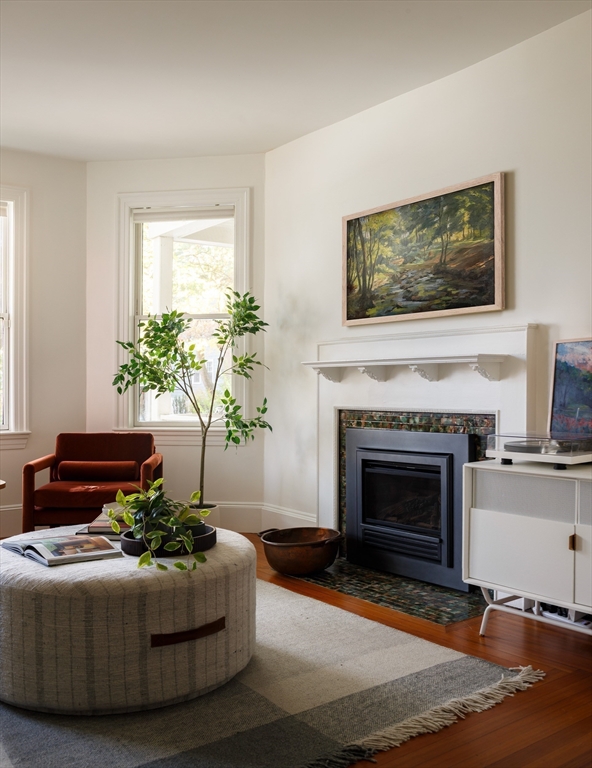 465 Huron Avenue, Unit 1 Cambridge, MA 02138 - Photo 2 of 23 a living room with furniture and a fireplace