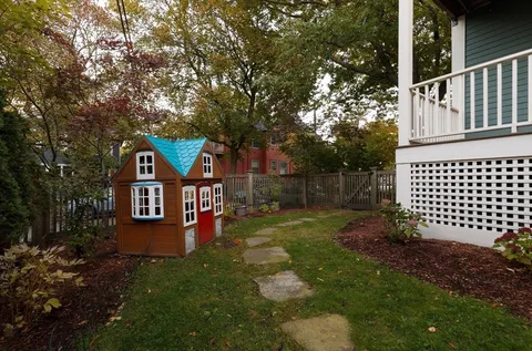 a view of a front of a house with a yard
