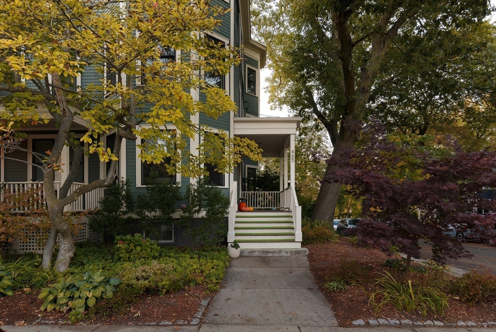 465 Huron Avenue, Unit 1 Cambridge, MA 02138 - Photo 23 of 23 a front view of a house with a yard