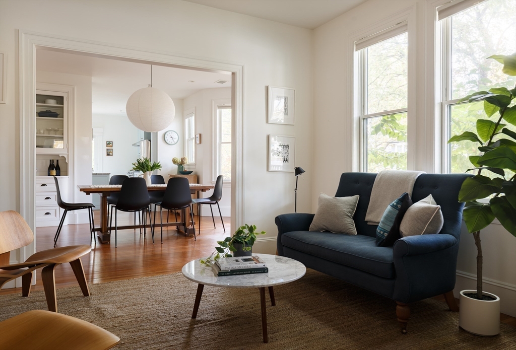465 Huron Avenue, Unit 1 Cambridge, MA 02138 - Photo 5 of 23 a living room with furniture and a large window