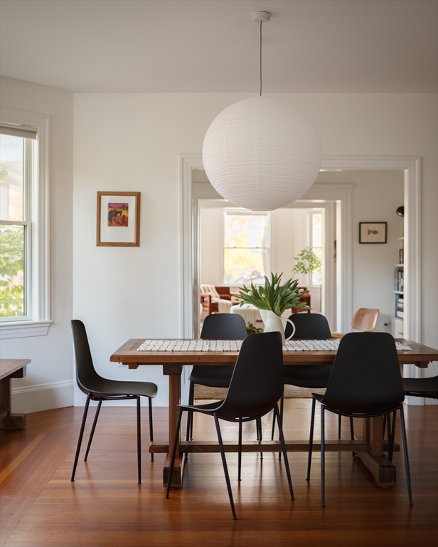 465 Huron Avenue, Unit 1 Cambridge, MA 02138 - Photo 6 of 23 a view of a dining room with furniture window and wooden floor