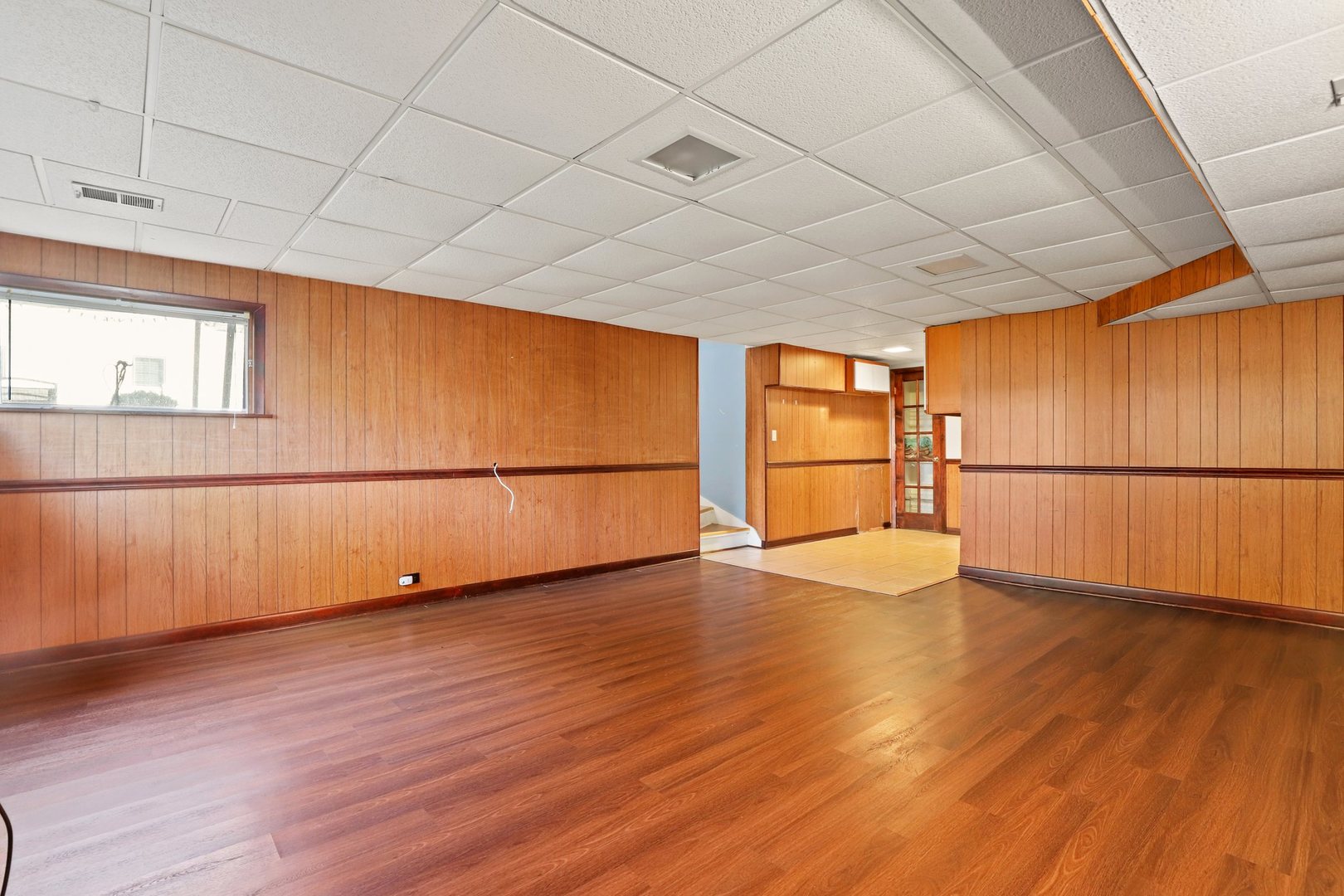 410 Ferndale Road Glenview, IL 60025 - Photo 21 of 34 a view of an empty room with wooden floor and a window