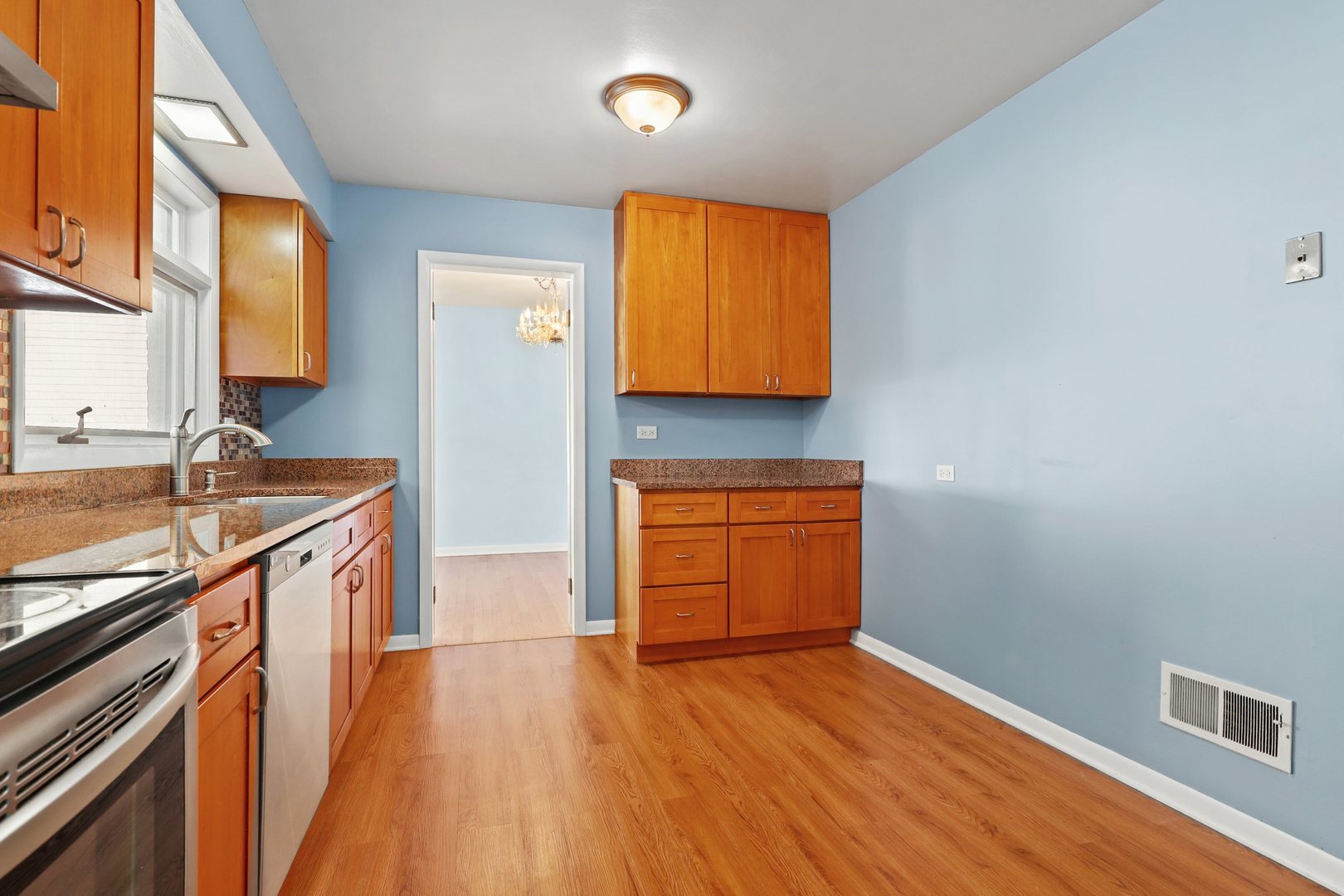 410 Ferndale Road Glenview, IL 60025 - Photo 10 of 34 a kitchen with granite countertop wooden floors and a sink