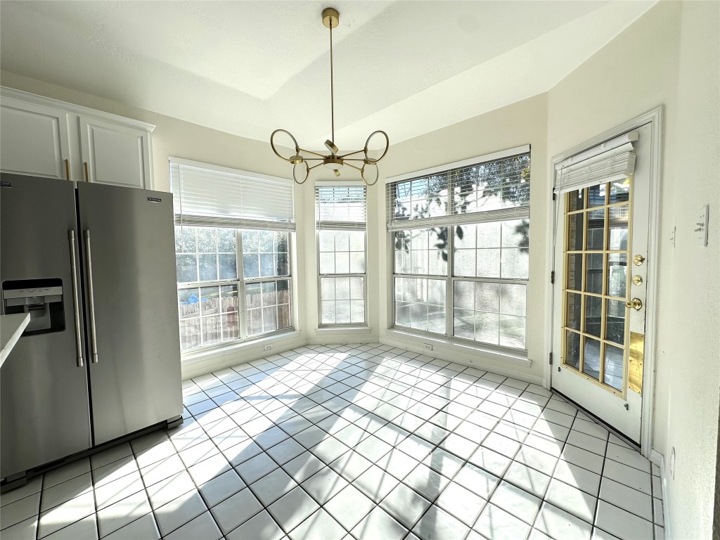 10305 Open Gate Drive Austin, TX 78726 - Photo 13 of 25 a view of empty room with wooden floor and fan