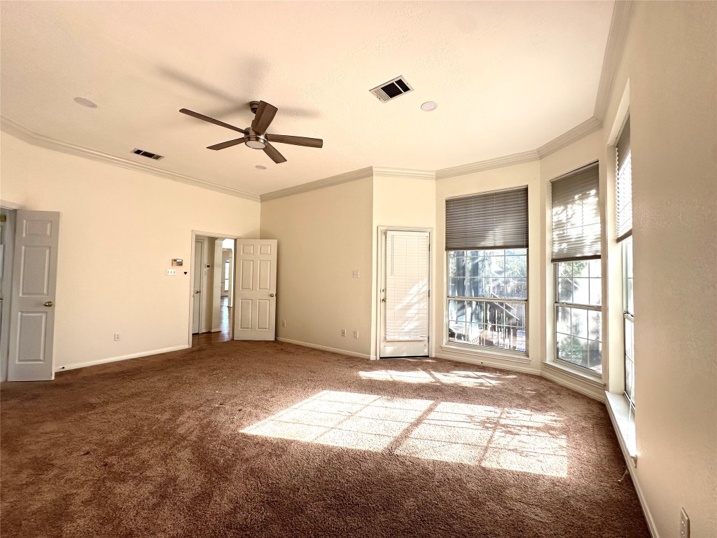 10305 Open Gate Drive Austin, TX 78726 - Photo 15 of 25 a view of a livingroom with a window and a ceiling fan