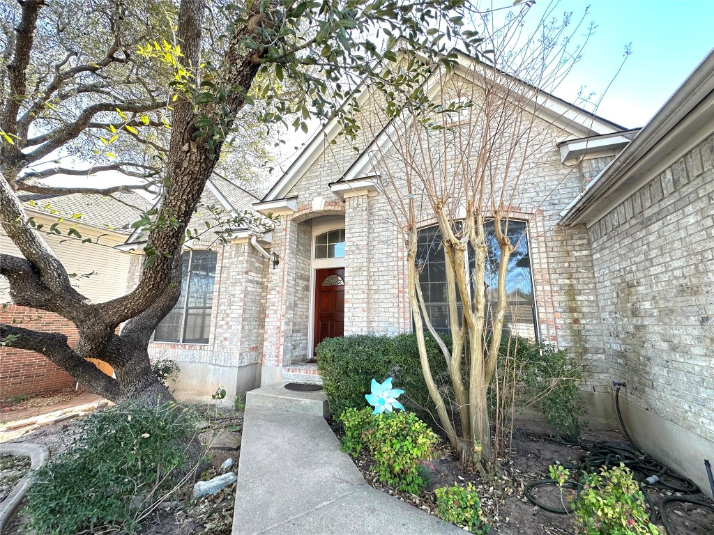 10305 Open Gate Drive Austin, TX 78726 - Photo 3 of 25 a front view of a house with garden