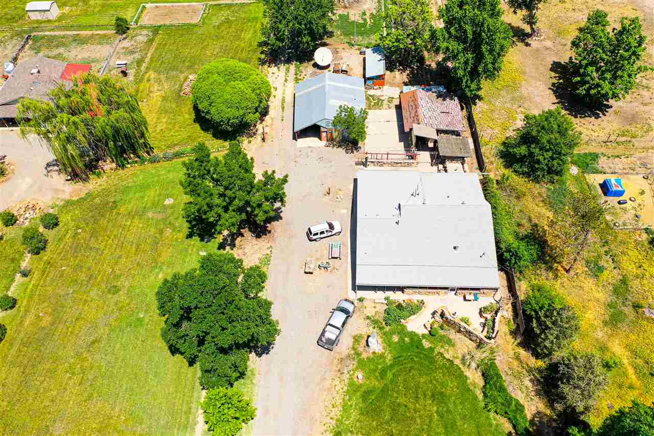 1862 J Road Fruita, CO 81521 - Photo 17 of 22 an aerial view of a house with a yard swimming pool and outdoor seating