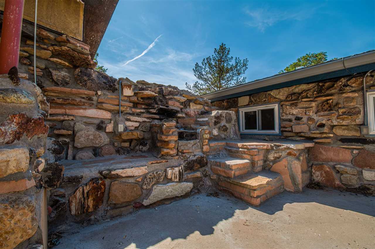 1862 J Road Fruita, CO 81521 - Photo 7 of 22 a view of a chairs and table in the patio