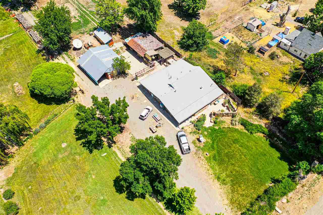 1862 J Road Fruita, CO 81521 - Photo 9 of 22 an aerial view of a house with swimming pool and garden