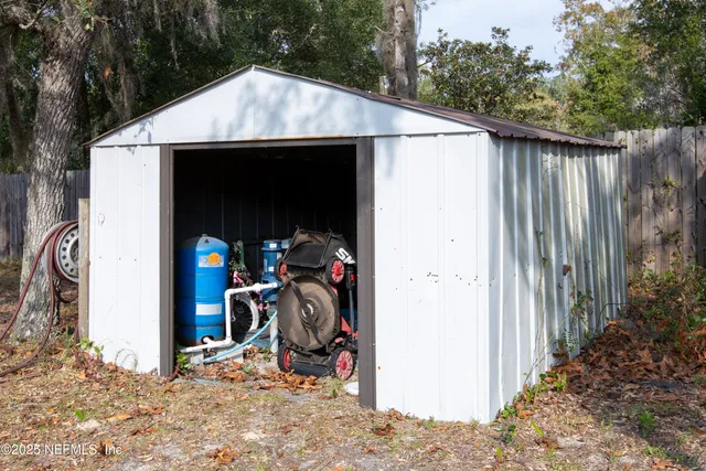 a view of a wooden house with a outdoor space