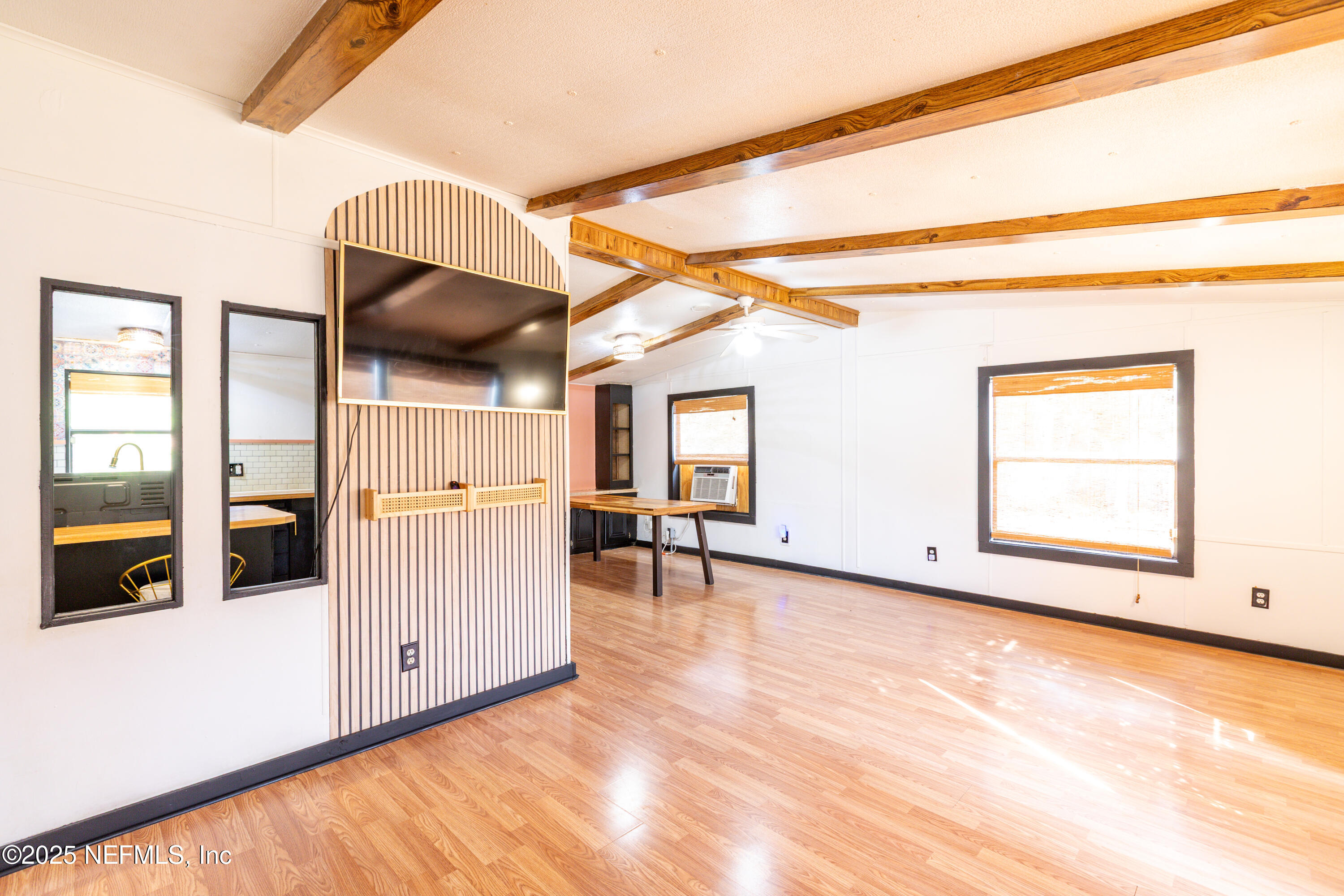6336 Bucknell Avenue Keystone Heights, FL 32656 - Photo 5 of 18 a view of a room with wooden floor and windows