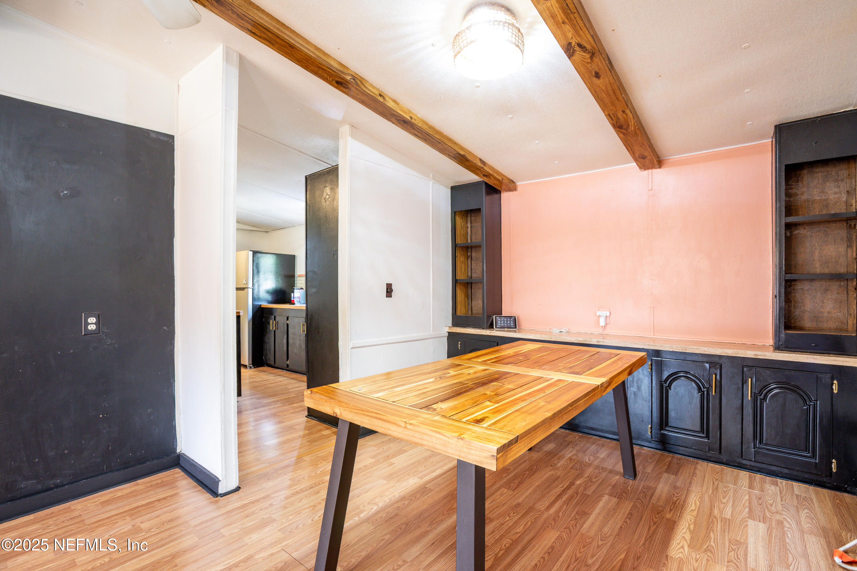 6336 Bucknell Avenue Keystone Heights, FL 32656 - Photo 7 of 18 a view of kitchen and dining room with wooden floor