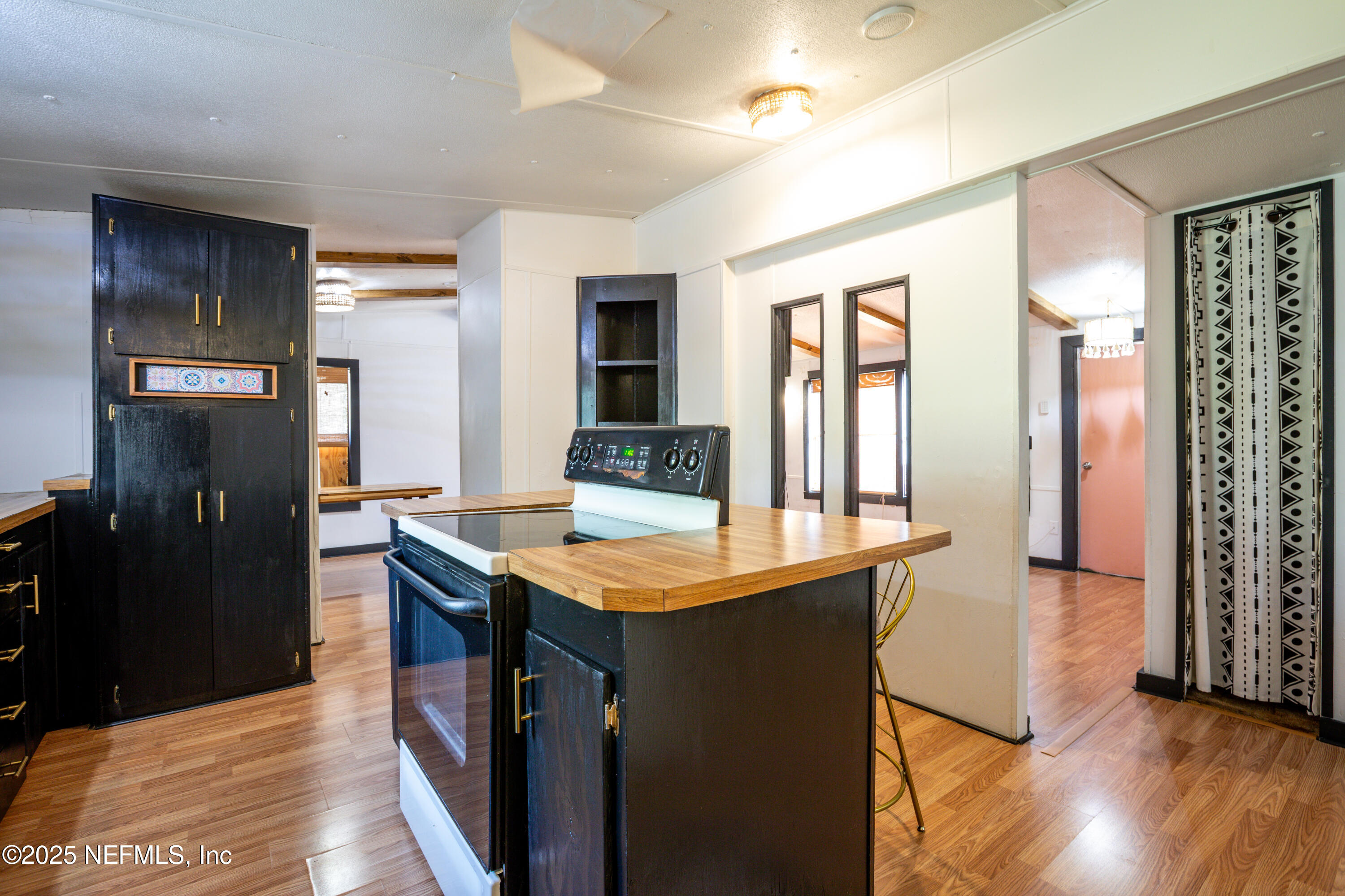 6336 Bucknell Avenue Keystone Heights, FL 32656 - Photo 8 of 18 a dining hall with stainless steel appliances granite countertop a sink dishwasher and a refrigerator with wooden floor