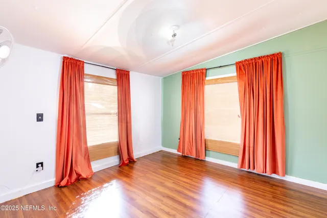 wooden floor and windows in a room
