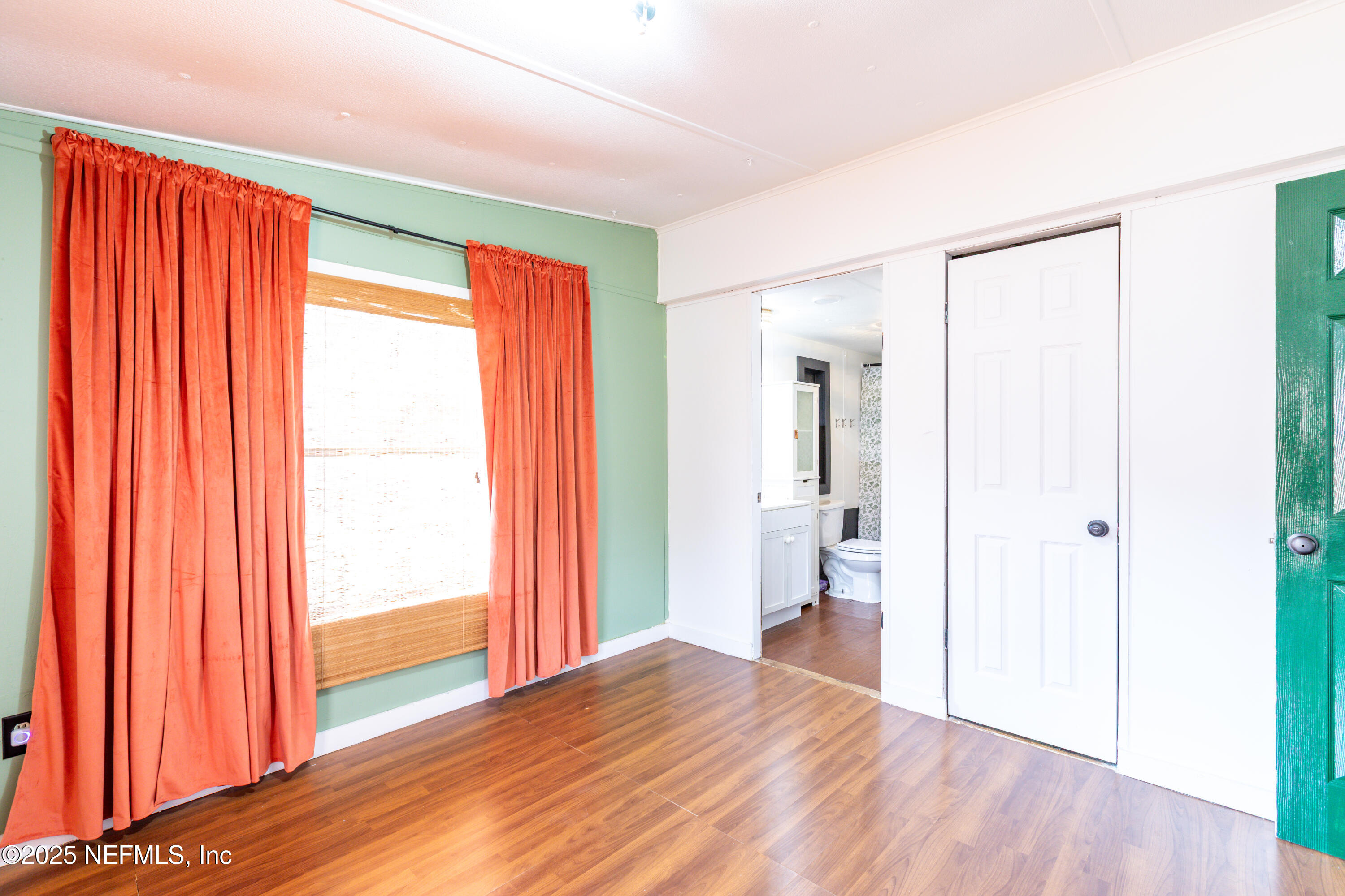6336 Bucknell Avenue Keystone Heights, FL 32656 - Photo 10 of 18 a view of empty room with wooden floor and fan