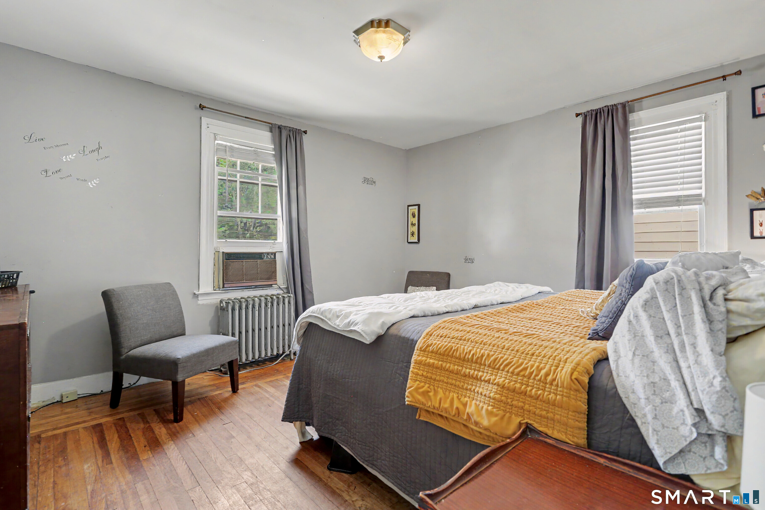 94 2nd Street Hamden, CT 06514 - Photo 21 of 31 a bed sitting in a bedroom next to a window
