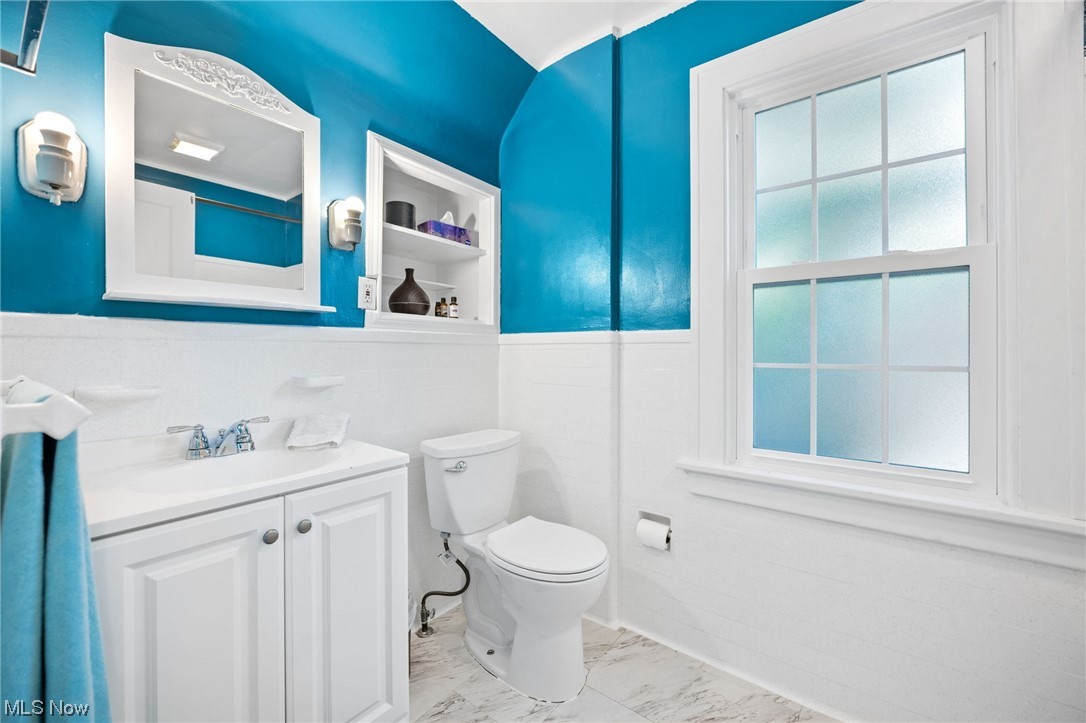3962 Orchard Road Cleveland Heights, OH 44121 - Photo 25 of 35 Bathroom featuring light tile flooring, large vanity, and mirror