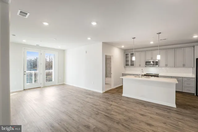 a view of kitchen with wooden floor