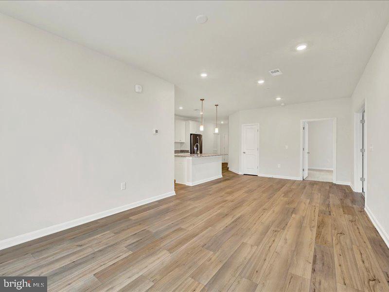 4003 Seaside Alder Road, Unit 307 HOLLY Bowie, MD 20720 - Photo 15 of 28 a view of empty room with wooden floor