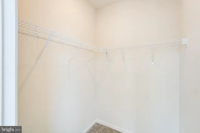 an empty room with a empty space and a window