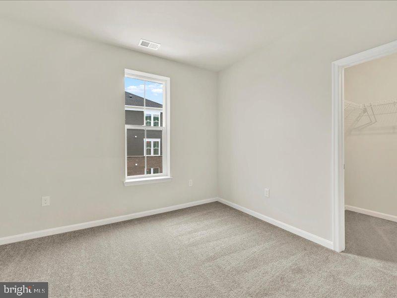 4003 Seaside Alder Road, Unit 307 HOLLY Bowie, MD 20720 - Photo 18 of 28 a view of an empty room with a window