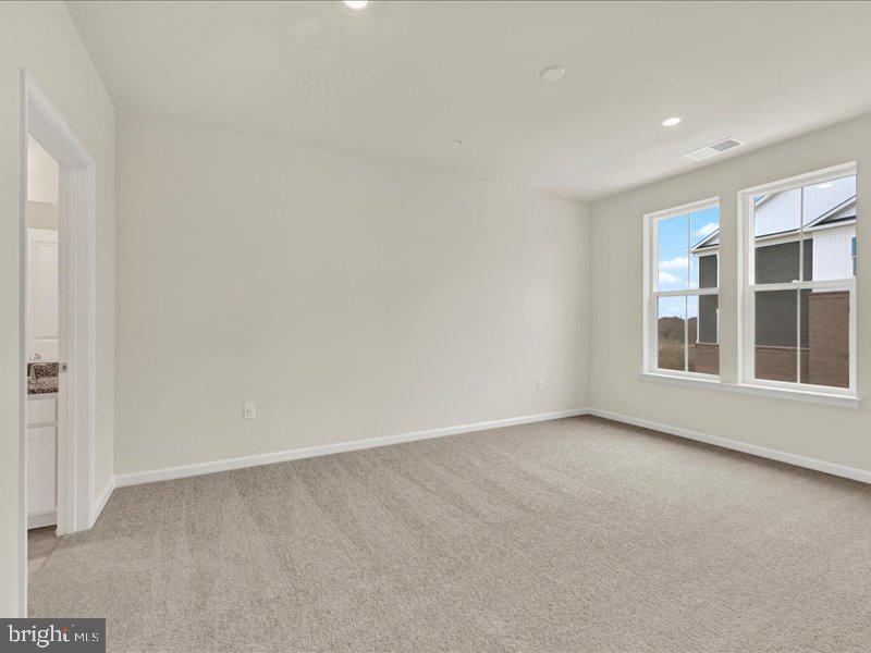 4003 Seaside Alder Road, Unit 307 HOLLY Bowie, MD 20720 - Photo 19 of 28 an empty room with windows