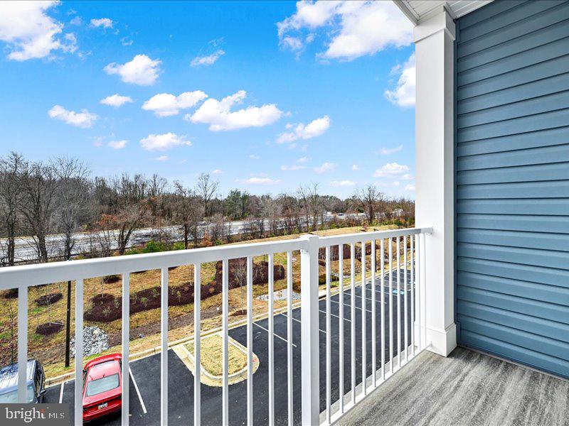 4003 Seaside Alder Road, Unit 307 HOLLY Bowie, MD 20720 - Photo 26 of 28 a view of a city from a balcony