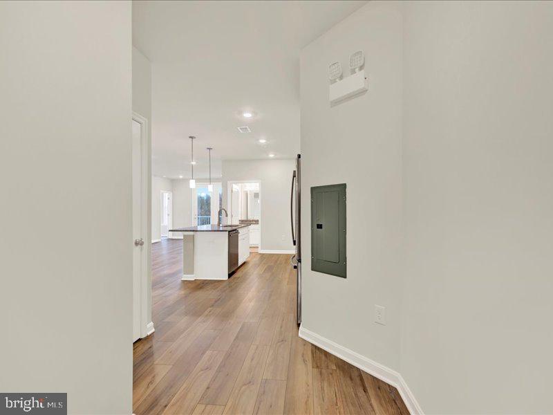 4003 Seaside Alder Road, Unit 307 HOLLY Bowie, MD 20720 - Photo 3 of 28 a view of a kitchen with wooden floor