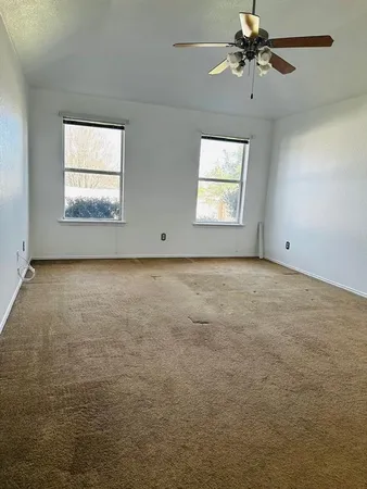 a bathroom with a shower and a toilet