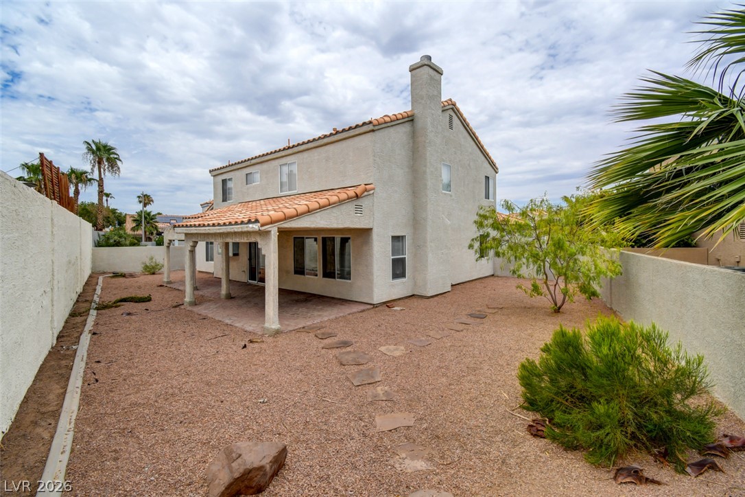 5 Tarryall Terrace Henderson, NV 89074 - Photo 42 of 44 A spacious backyard with covered patio, ideal for outdoor gatherings.