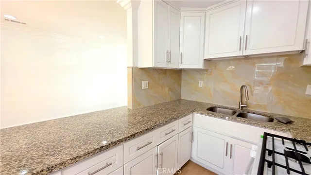 a view of a kitchen cabinets and a counter place