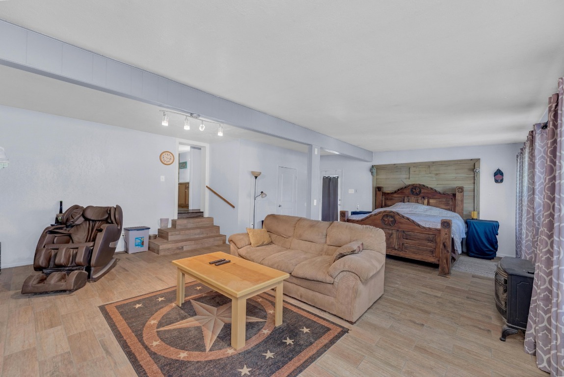 148 Meadows Drive Elgin, TX 78621 - Photo 16 of 38 a living room with furniture and a wooden floor