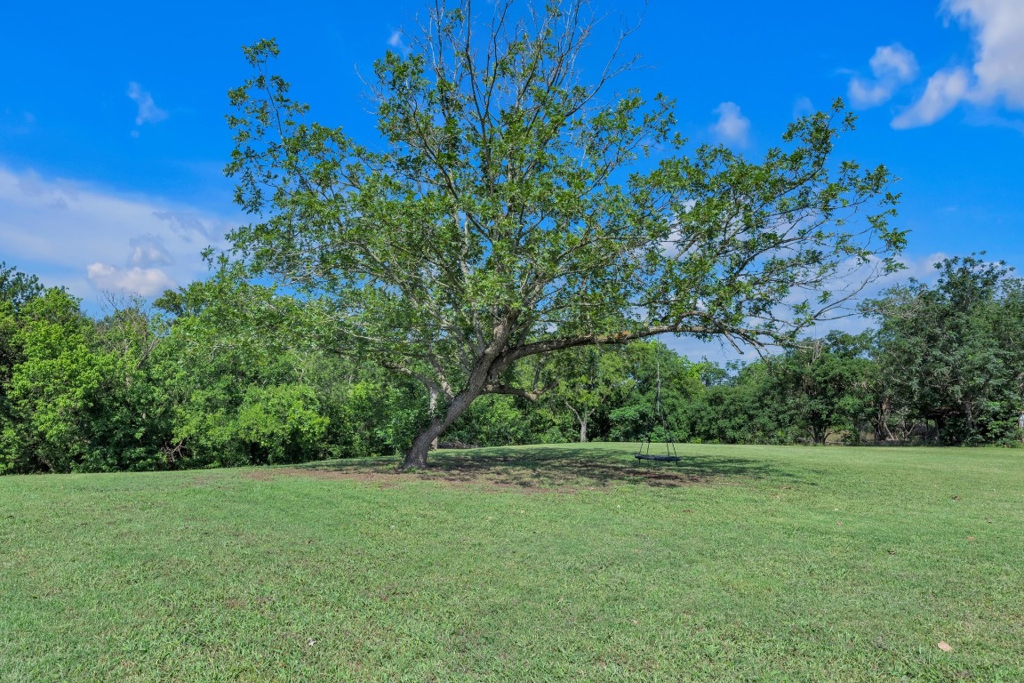 148 Meadows Drive Elgin, TX 78621 - Photo 3 of 38 a view of outdoor space with deck and yard