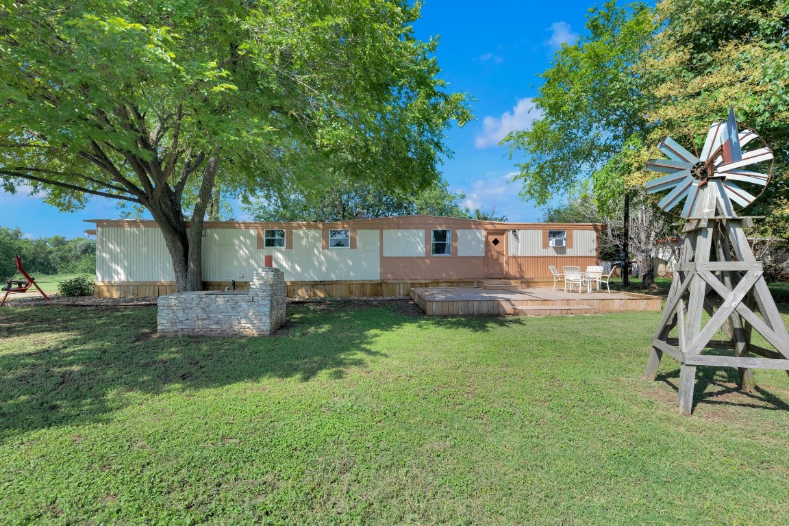 148 Meadows Drive Elgin, TX 78621 - Photo 34 of 38 a house view with a sitting space and garden