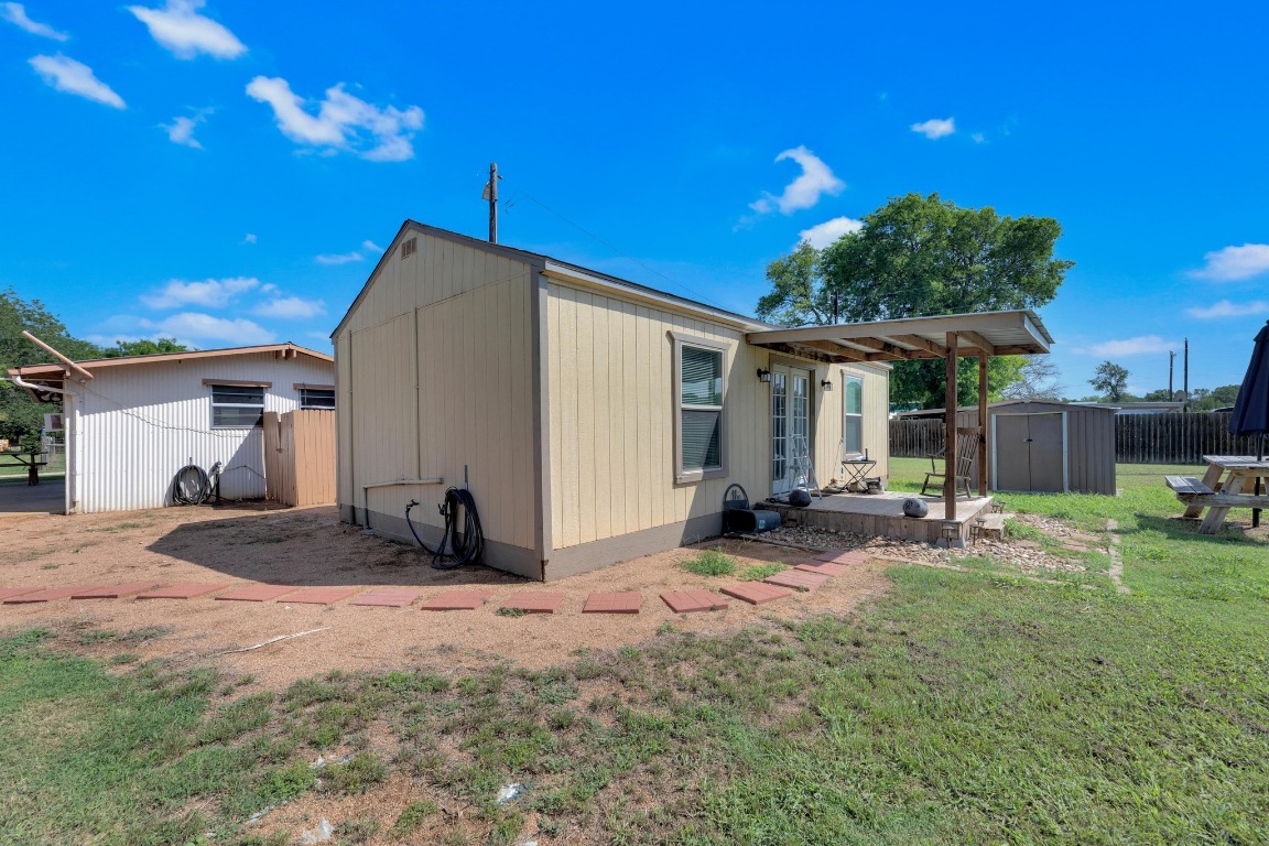 148 Meadows Drive Elgin, TX 78621 - Photo 8 of 38 a view of a house with backyard and sitting area